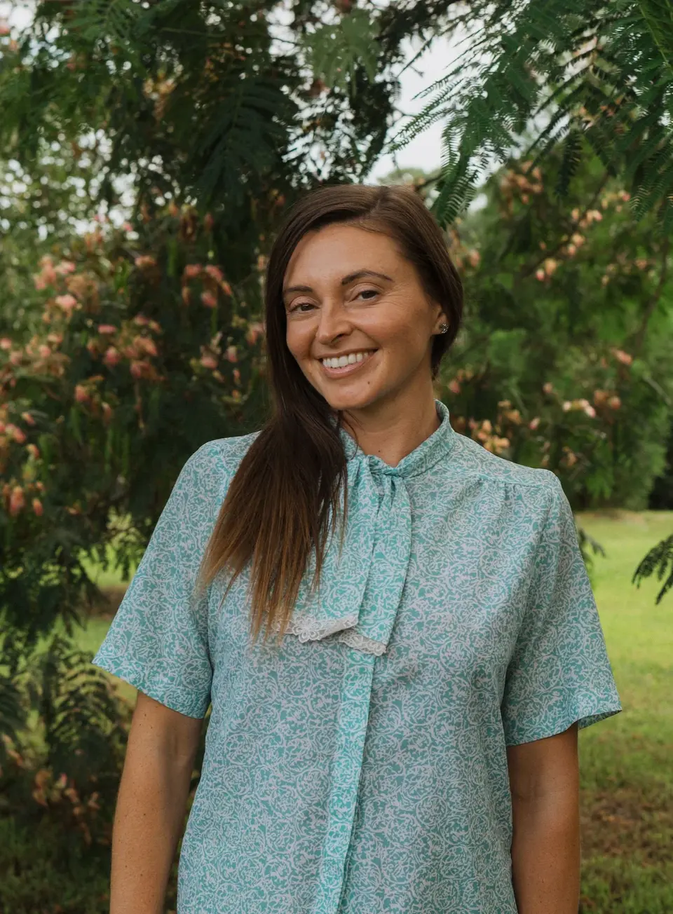 Dr. Sinéad Corrigan standing among tropical greenery